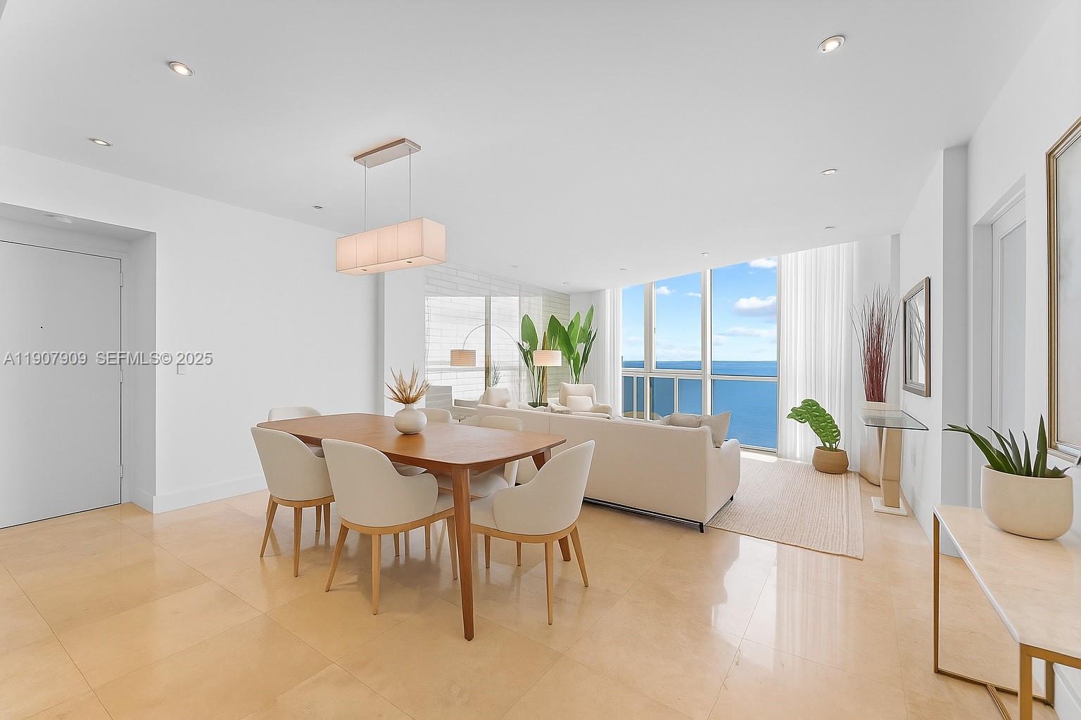665 Northeast 25th Street, Unit PHI01 Miami, FL 33137 - Photo 3 of 38 a view of a dining room with furniture and a table