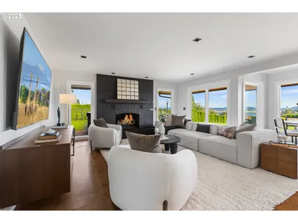 a living room with fireplace furniture and a flat screen tv