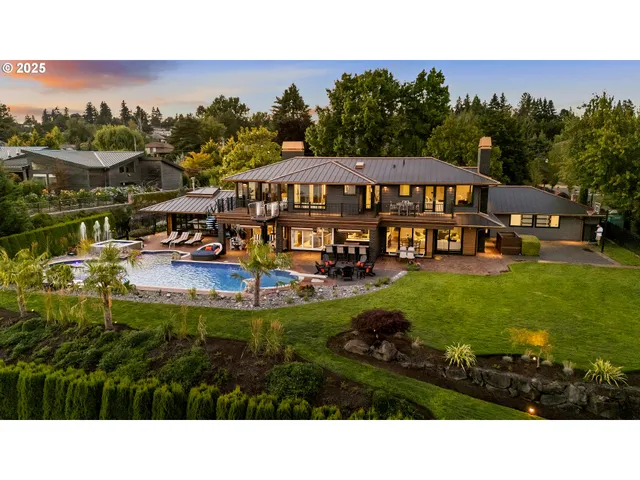 a view of a house with garden and sitting area