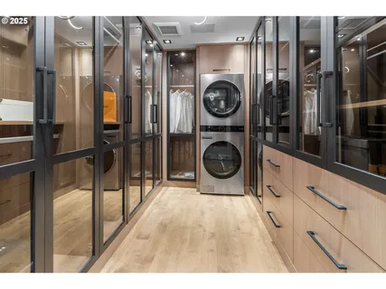 a view of a hallway with washer and dryer