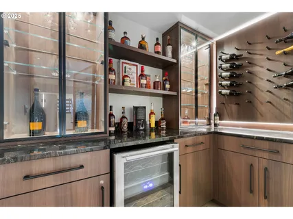 a kitchen with stainless steel appliances a sink and cabinets