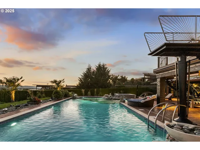 a view of a swimming pool with lounge chair