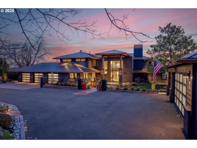 a view of a house with a yard and sitting area