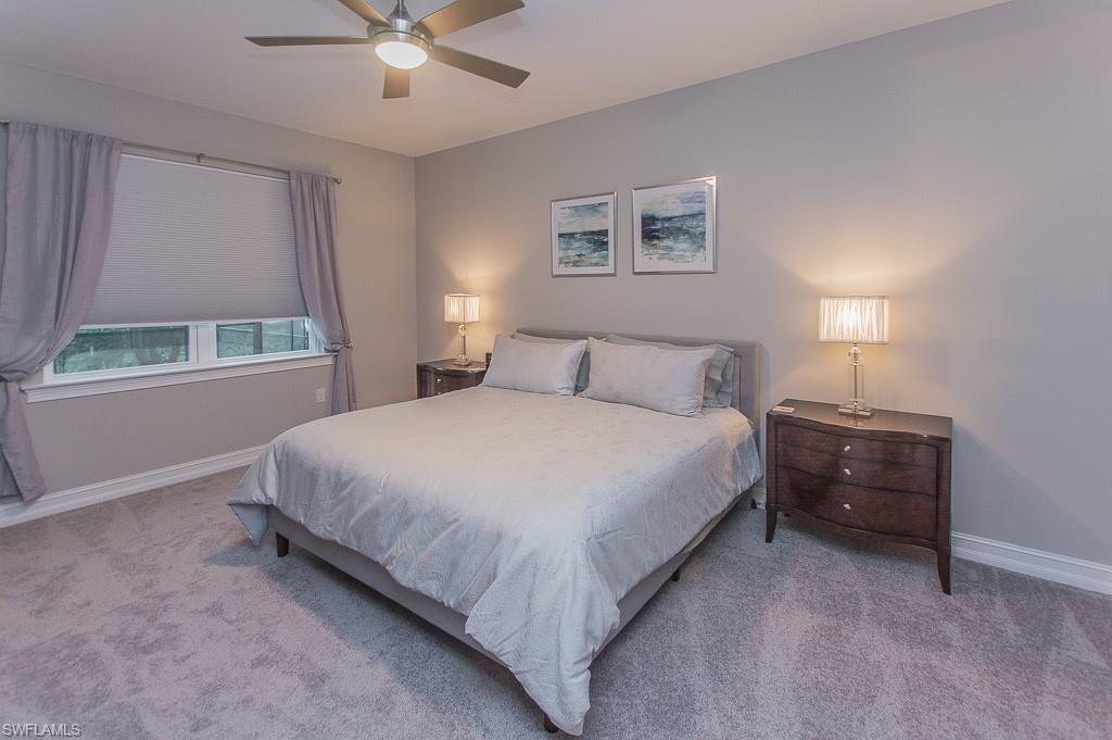 14670 Catamaran Place Naples, FL 34114 - Photo 11 of 24 a bedroom with a bed and window