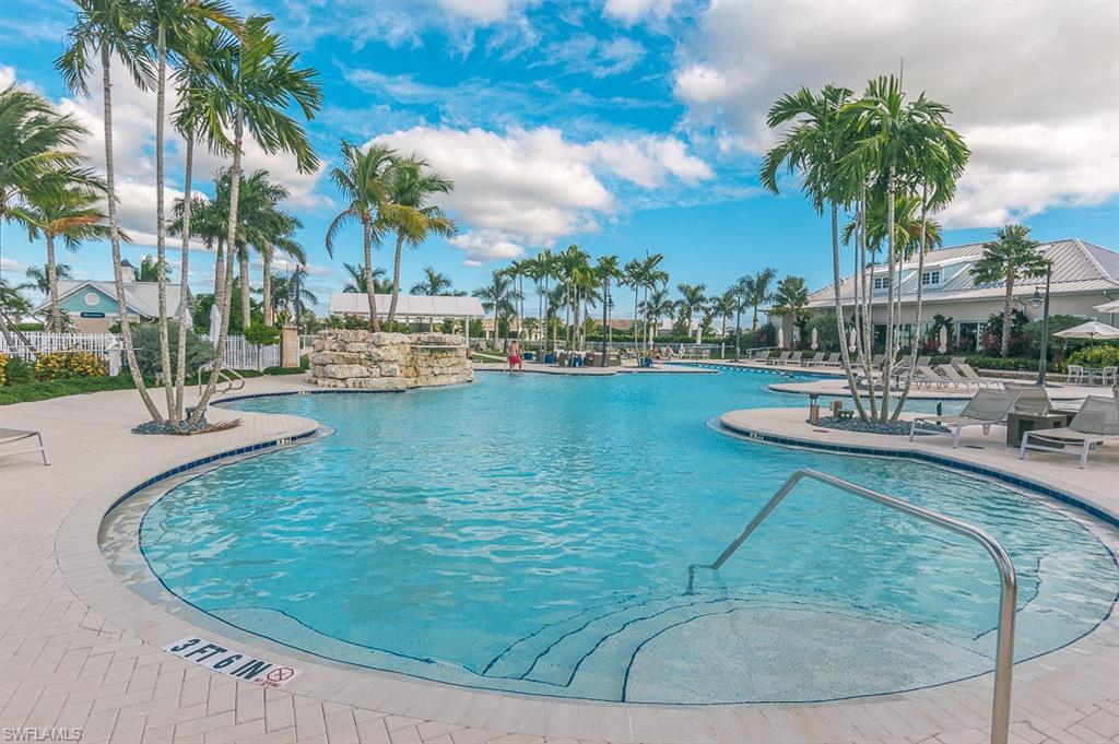14670 Catamaran Place Naples, FL 34114 - Photo 19 of 24 a view of a swimming pool with a table and chairs