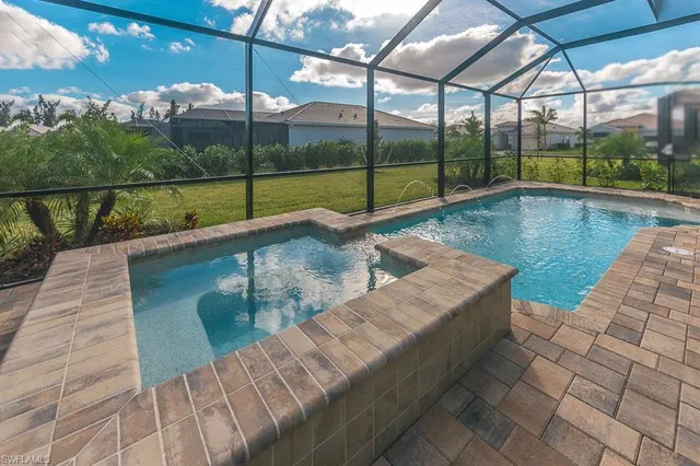 a view of swimming pool with a patio