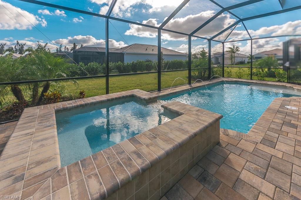 14670 Catamaran Place Naples, FL 34114 - Photo 2 of 24 a view of swimming pool with a patio