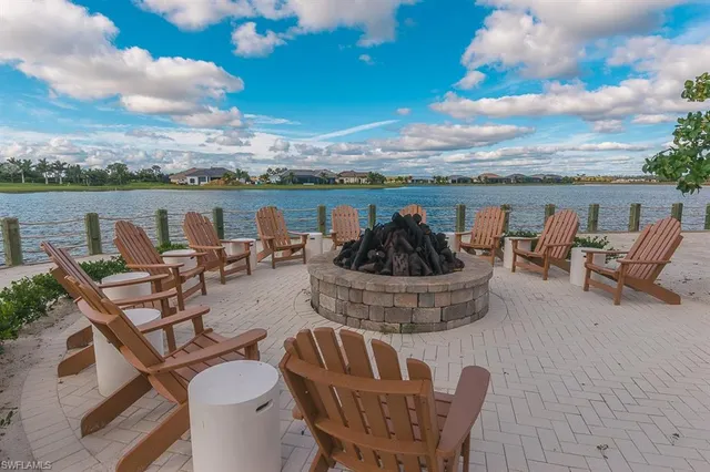 a view of a roof deck with furniture
