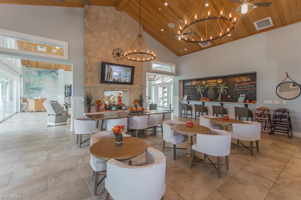 14670 Catamaran Place Naples, FL 34114 - Photo 24 of 24 a living room with furniture and a flat screen tv