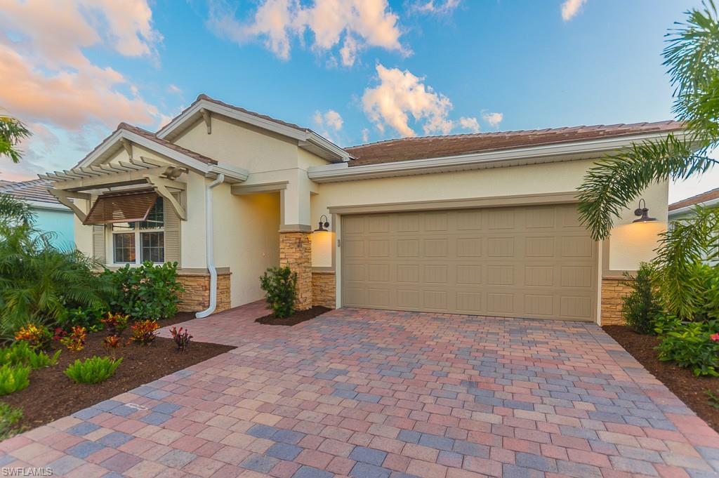 14670 Catamaran Place Naples, FL 34114 - Photo 3 of 24 a view of a house with a yard