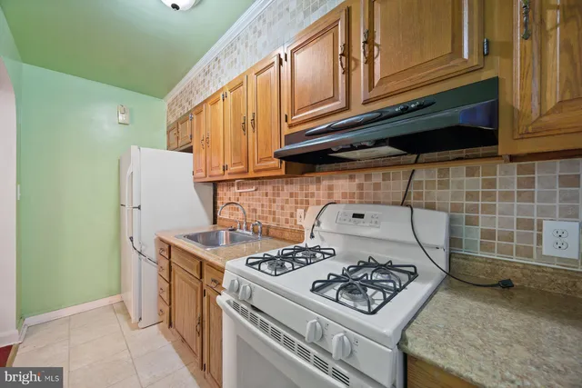 a kitchen with a stove and a microwave