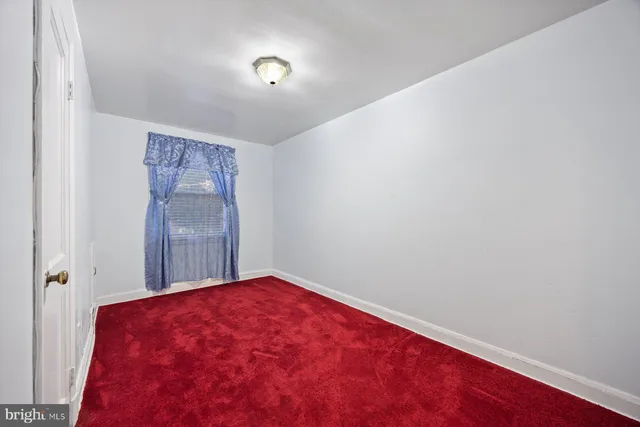 a view of a big room with windows