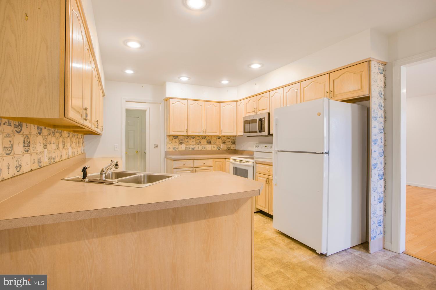 380 Koser Road Lititz, PA 17543 - Photo 11 of 35 a kitchen with refrigerator and cabinets