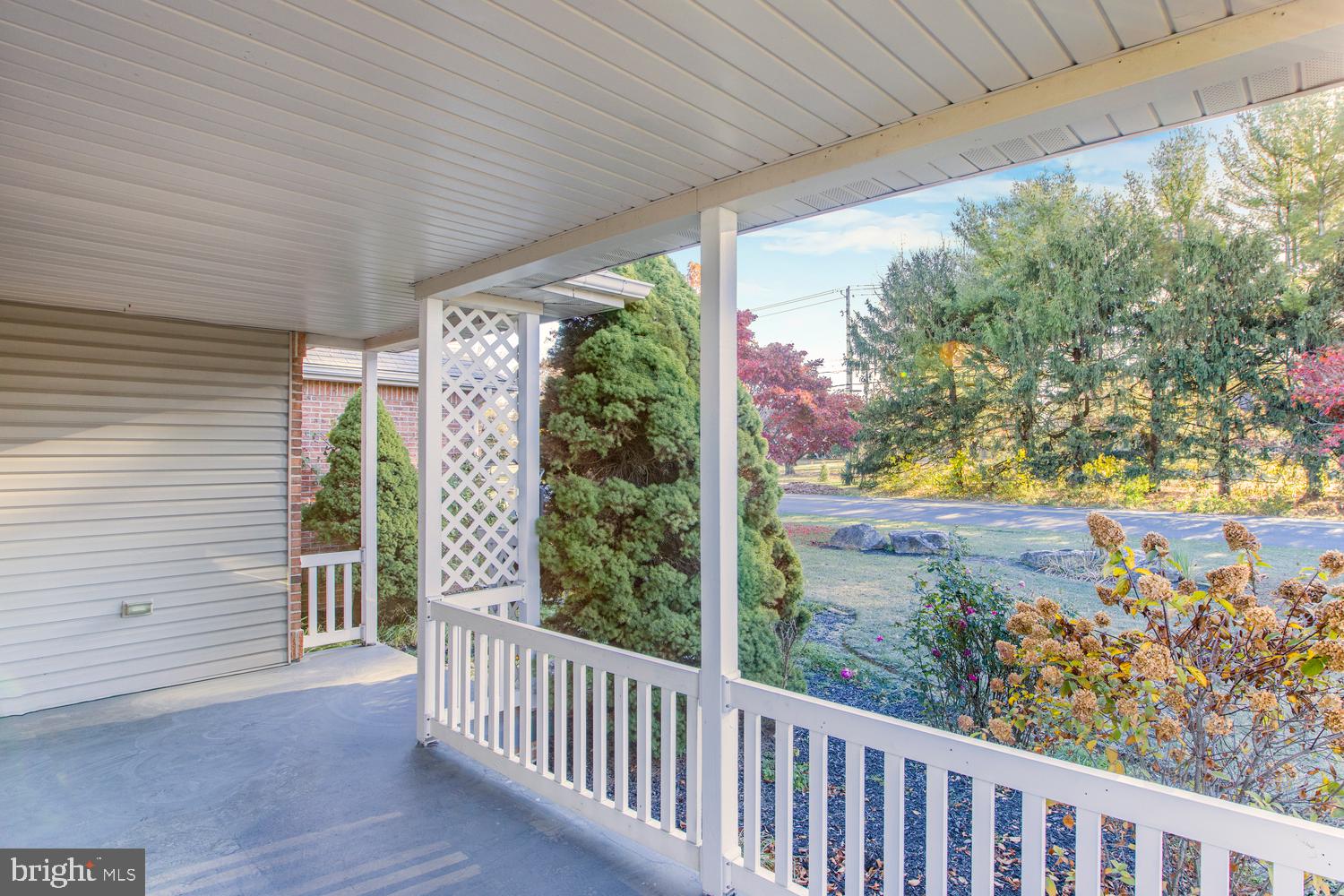 380 Koser Road Lititz, PA 17543 - Photo 4 of 35 a view of a porch with a table and chairs and wooden fence