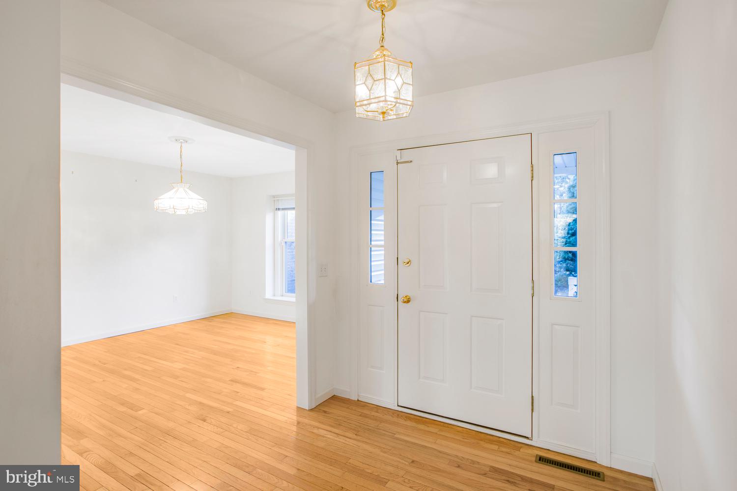 380 Koser Road Lititz, PA 17543 - Photo 5 of 35 a view of an empty room with wooden floor and a window