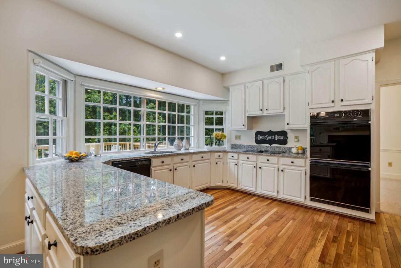 2311 Ridge Tree Court Ellicott City, MD 21042 - Photo 12 of 66 Kitchen w/Granite & Double Oven