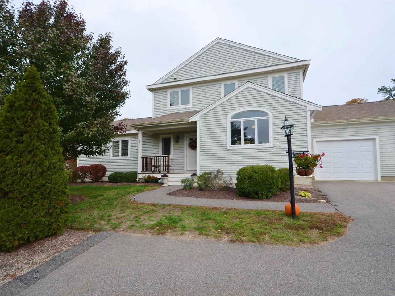 13 Aspen Road Buzzards Bay, MA 02532 - Photo 1 of 29 a front view of a house with garden and porch