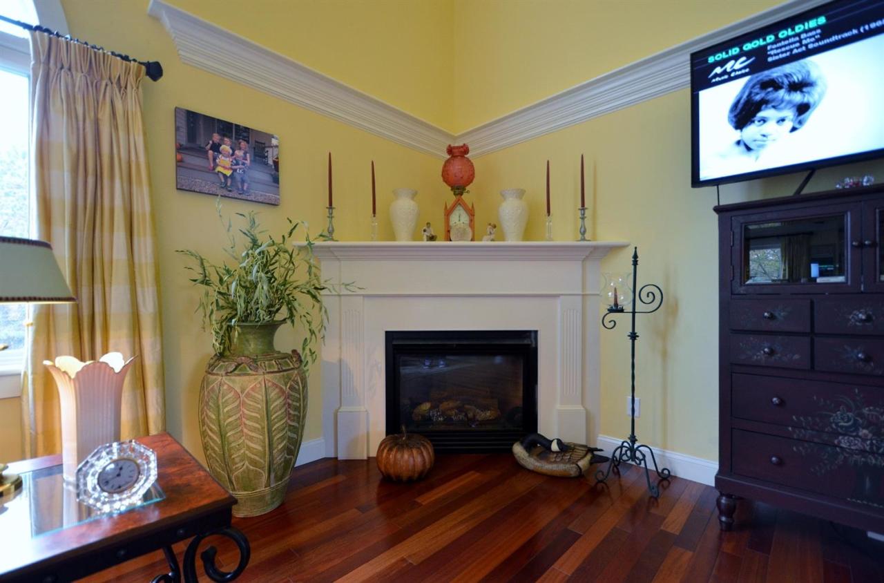 13 Aspen Road Buzzards Bay, MA 02532 - Photo 11 of 29 a living room with furniture and a fireplace