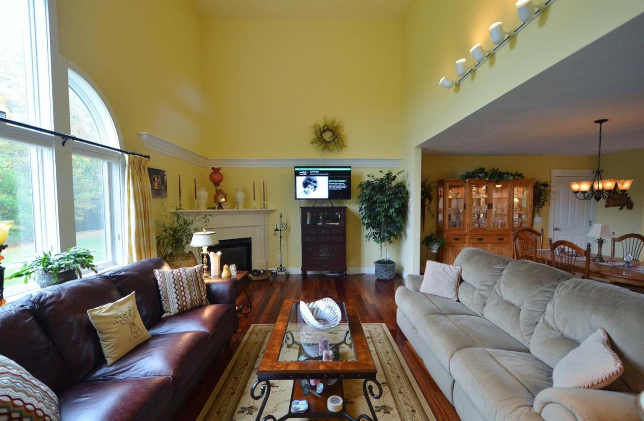 13 Aspen Road Buzzards Bay, MA 02532 - Photo 12 of 29 a living room with furniture and a fireplace
