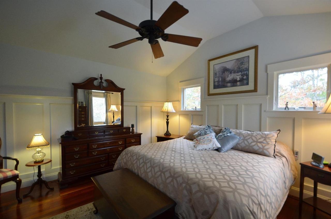 13 Aspen Road Buzzards Bay, MA 02532 - Photo 15 of 29 a bedroom with a bed and a chandelier