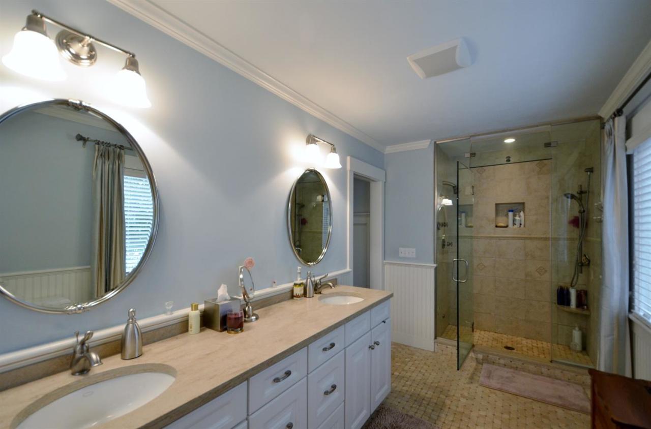 13 Aspen Road Buzzards Bay, MA 02532 - Photo 17 of 29 a bathroom with a double vanity sink mirror and shower