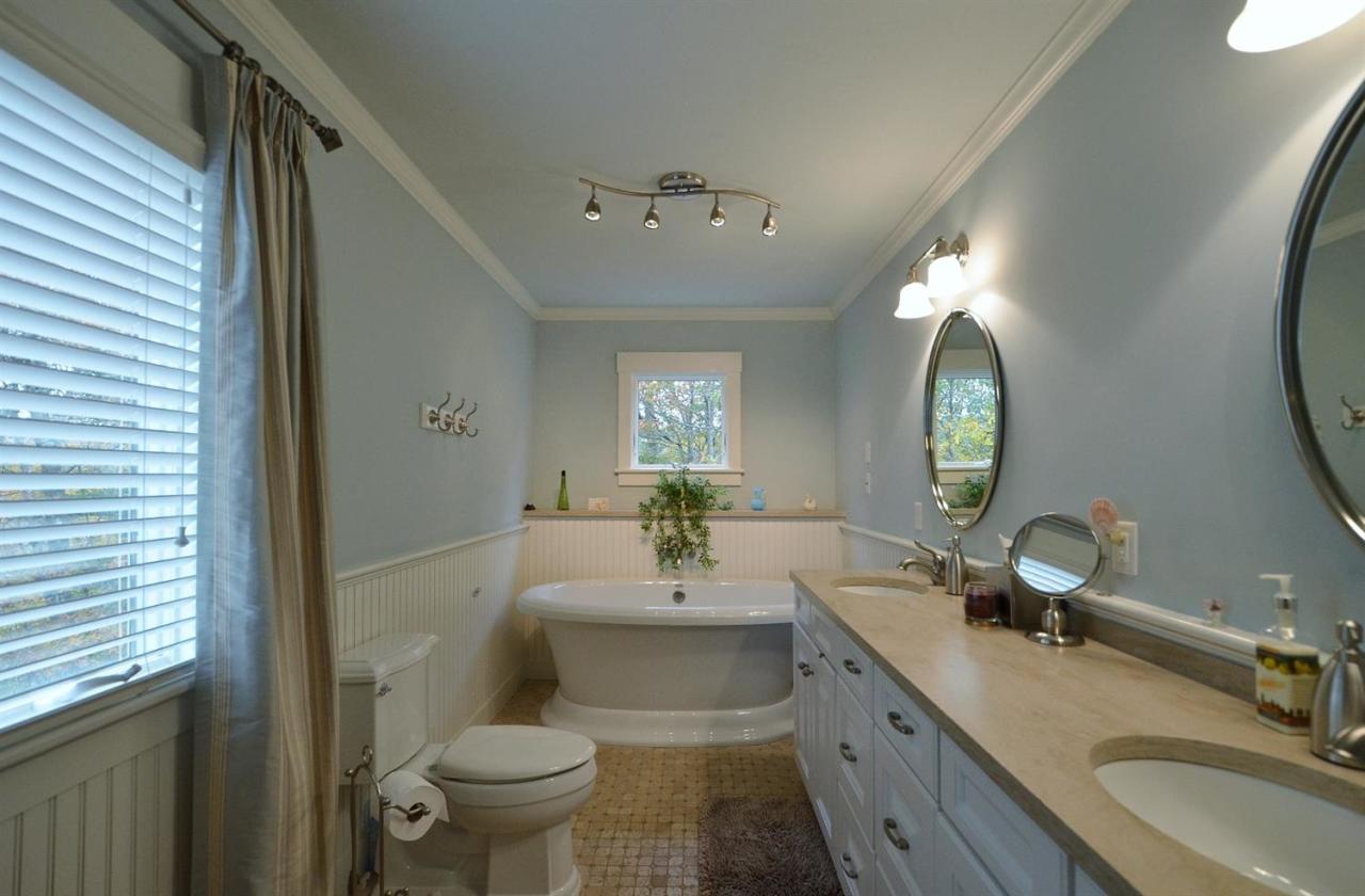 13 Aspen Road Buzzards Bay, MA 02532 - Photo 18 of 29 a bathroom with a toilet a sink and mirror