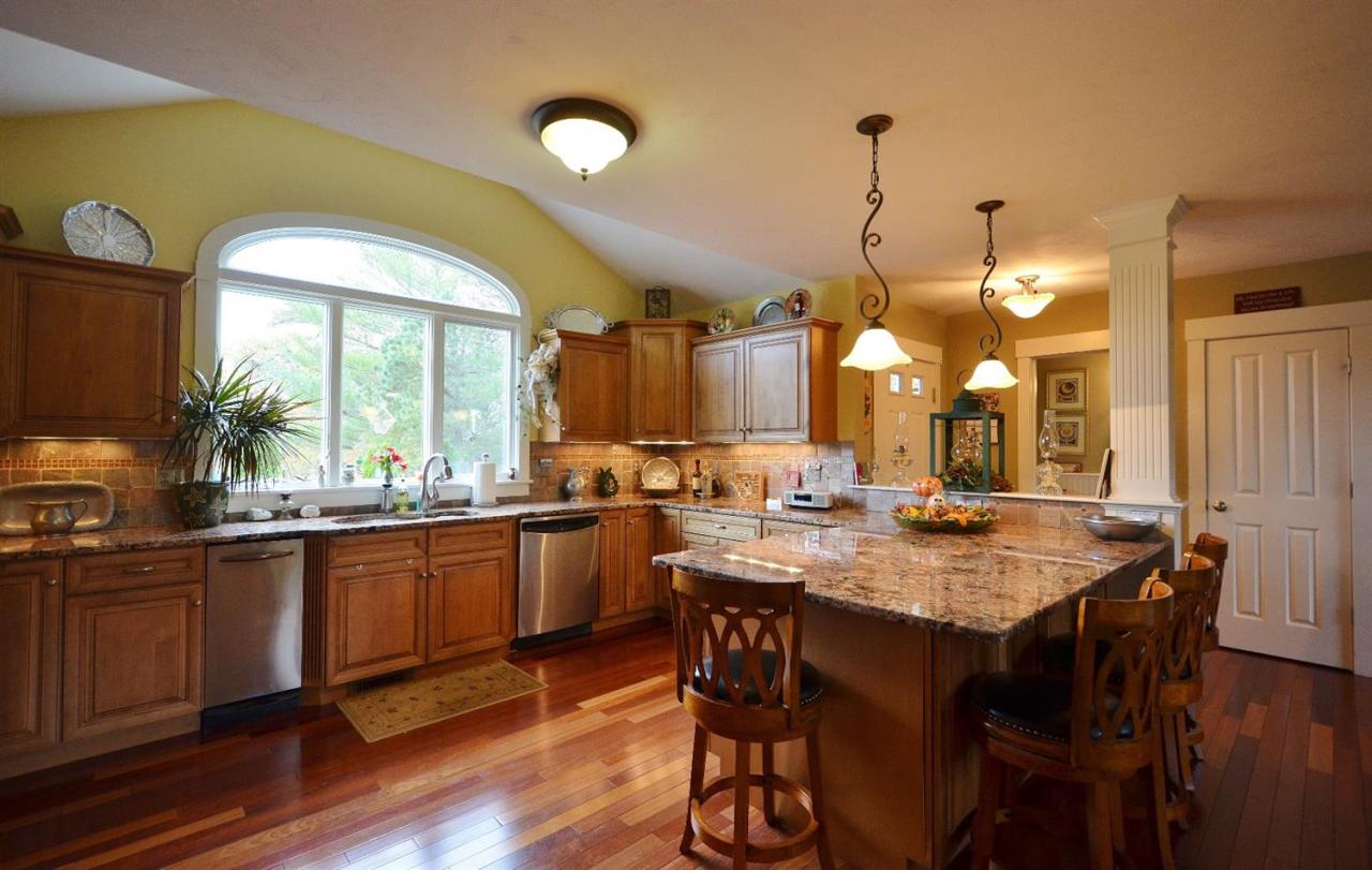 13 Aspen Road Buzzards Bay, MA 02532 - Photo 2 of 29 a dining table with chairs and wooden floor