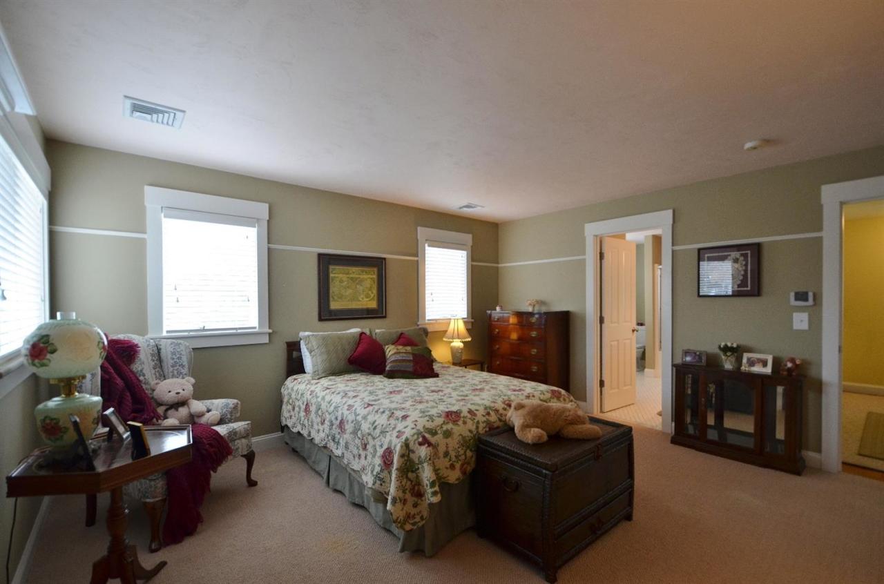 13 Aspen Road Buzzards Bay, MA 02532 - Photo 21 of 29 a bedroom with a bed couches and a flat tv screen