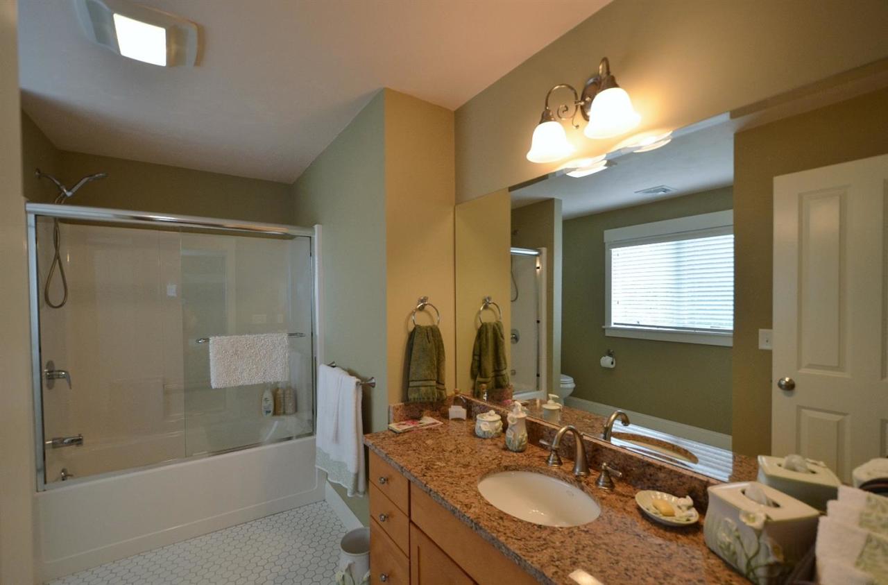 13 Aspen Road Buzzards Bay, MA 02532 - Photo 23 of 29 a bathroom with a granite countertop sink mirror and a bathtub