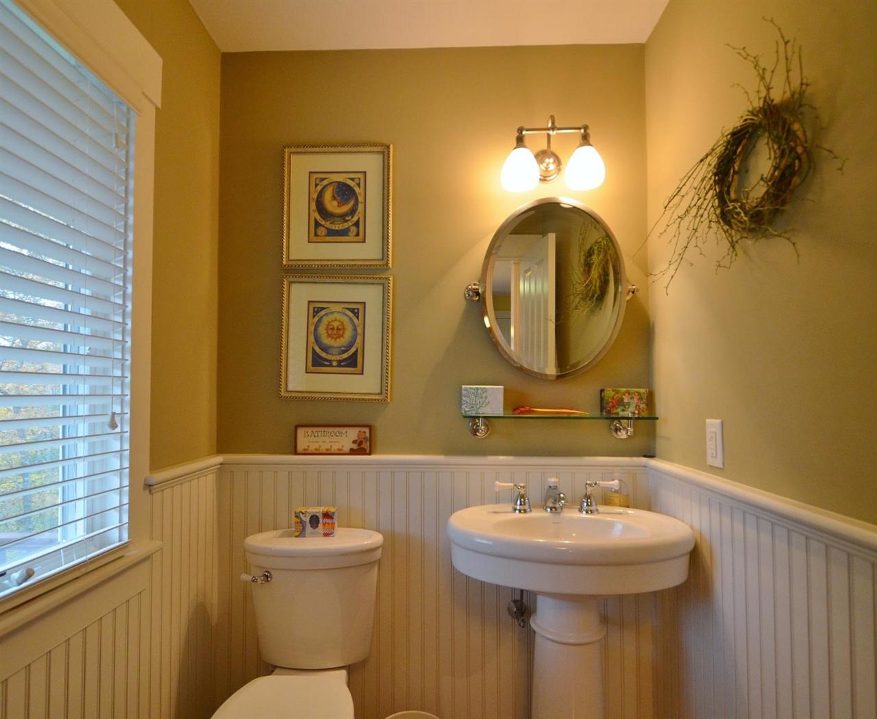 13 Aspen Road Buzzards Bay, MA 02532 - Photo 24 of 29 a bathroom with a toilet sink and mirror