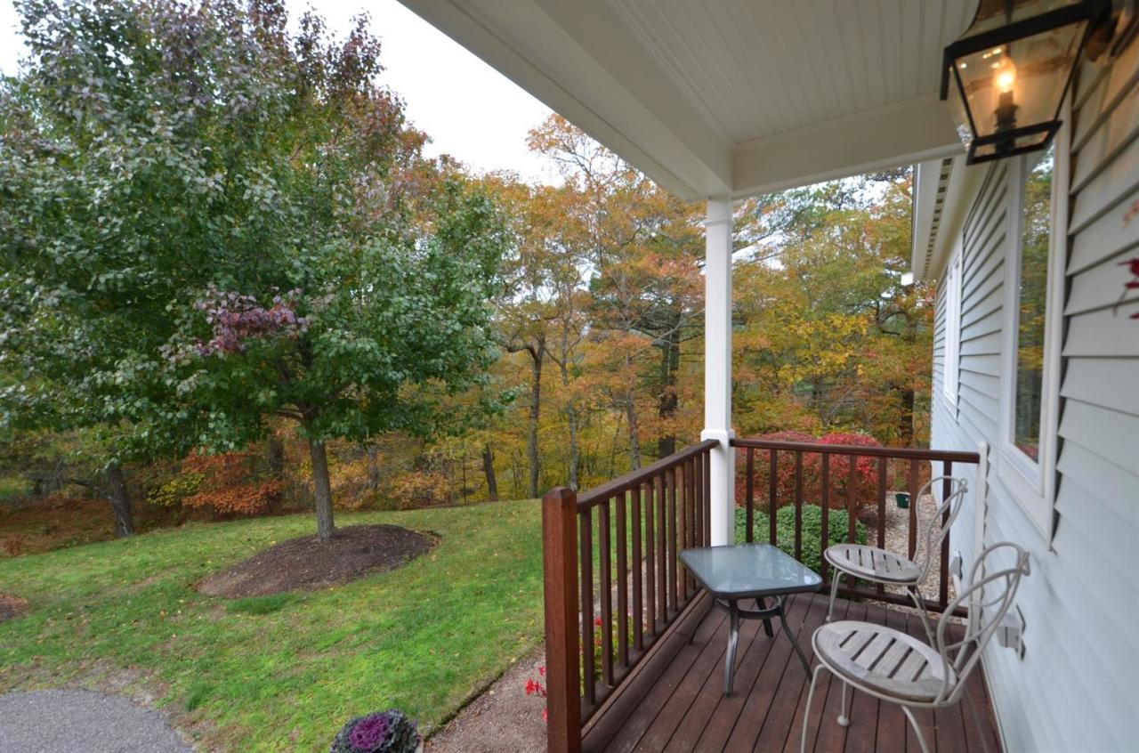 13 Aspen Road Buzzards Bay, MA 02532 - Photo 25 of 29 a view of a chair and tables in the yard