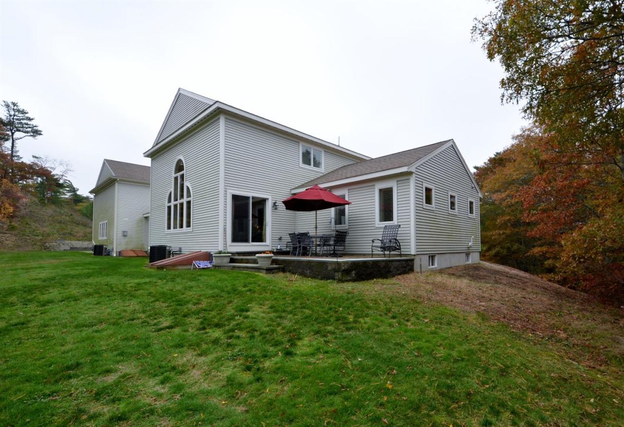 13 Aspen Road Buzzards Bay, MA 02532 - Photo 27 of 29 a front view of house with yard and seating area
