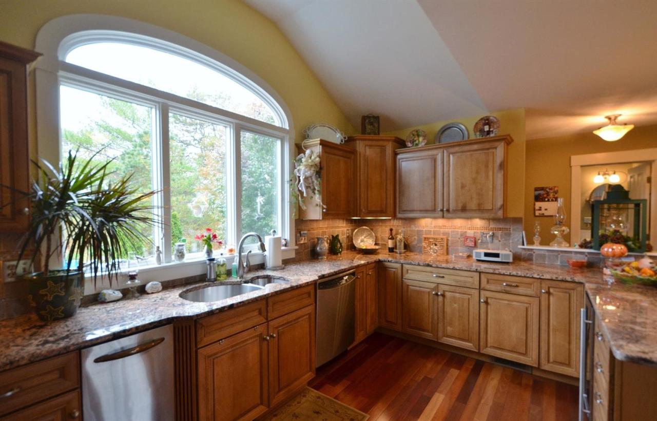 13 Aspen Road Buzzards Bay, MA 02532 - Photo 3 of 29 a kitchen with lots of counter space sink and large windows