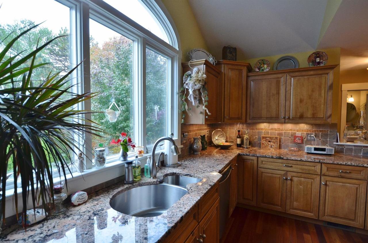 13 Aspen Road Buzzards Bay, MA 02532 - Photo 8 of 29 a kitchen with a sink and a large window