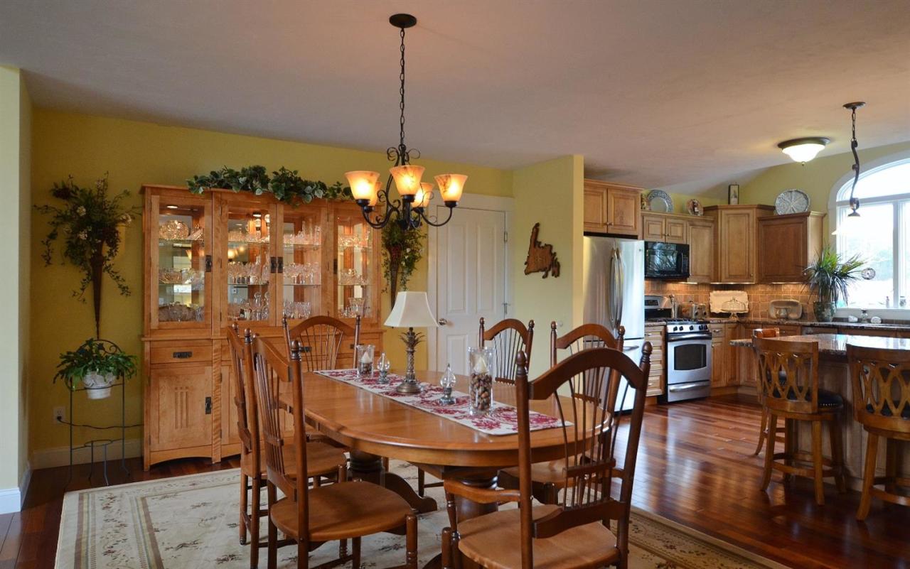 13 Aspen Road Buzzards Bay, MA 02532 - Photo 9 of 29 a view of a dining room with furniture and chandelier