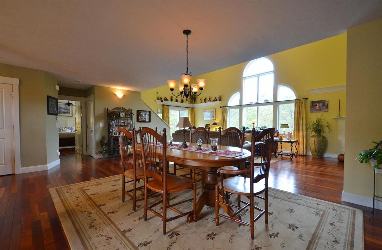 13 Aspen Road Buzzards Bay, MA 02532 - Photo 10 of 29 a view of a dining room with furniture window and wooden floor