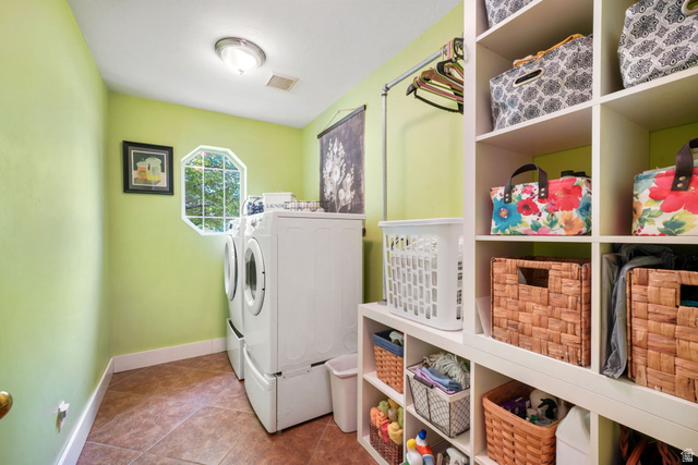 357 South 320 W Street Lindon, UT 84042 - Photo 20 of 41 Laundry room featuring an octagonal window, white baseboard trim, and ceramic tile flooring
