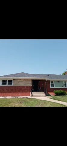 a bathroom with a sink and a large window