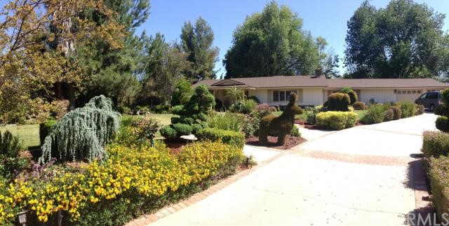16340 Whispering Spur Street Riverside, CA 92504 - Photo 1 of 1 Front Driveway passing by the beautiful gardens.