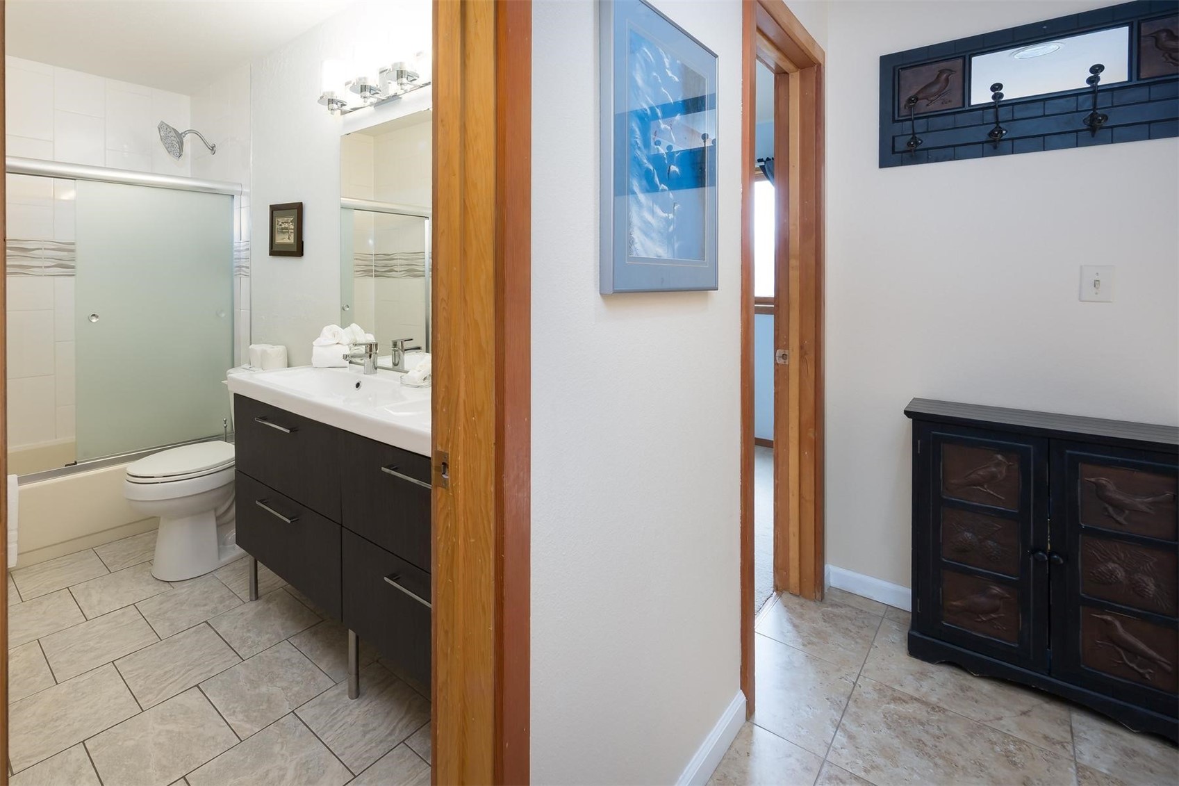 91100 Ryan Gulch Road, Unit 91105 Silverthorne, CO 80498 - Photo 16 of 49 a bathroom with a sink a toilet and shower