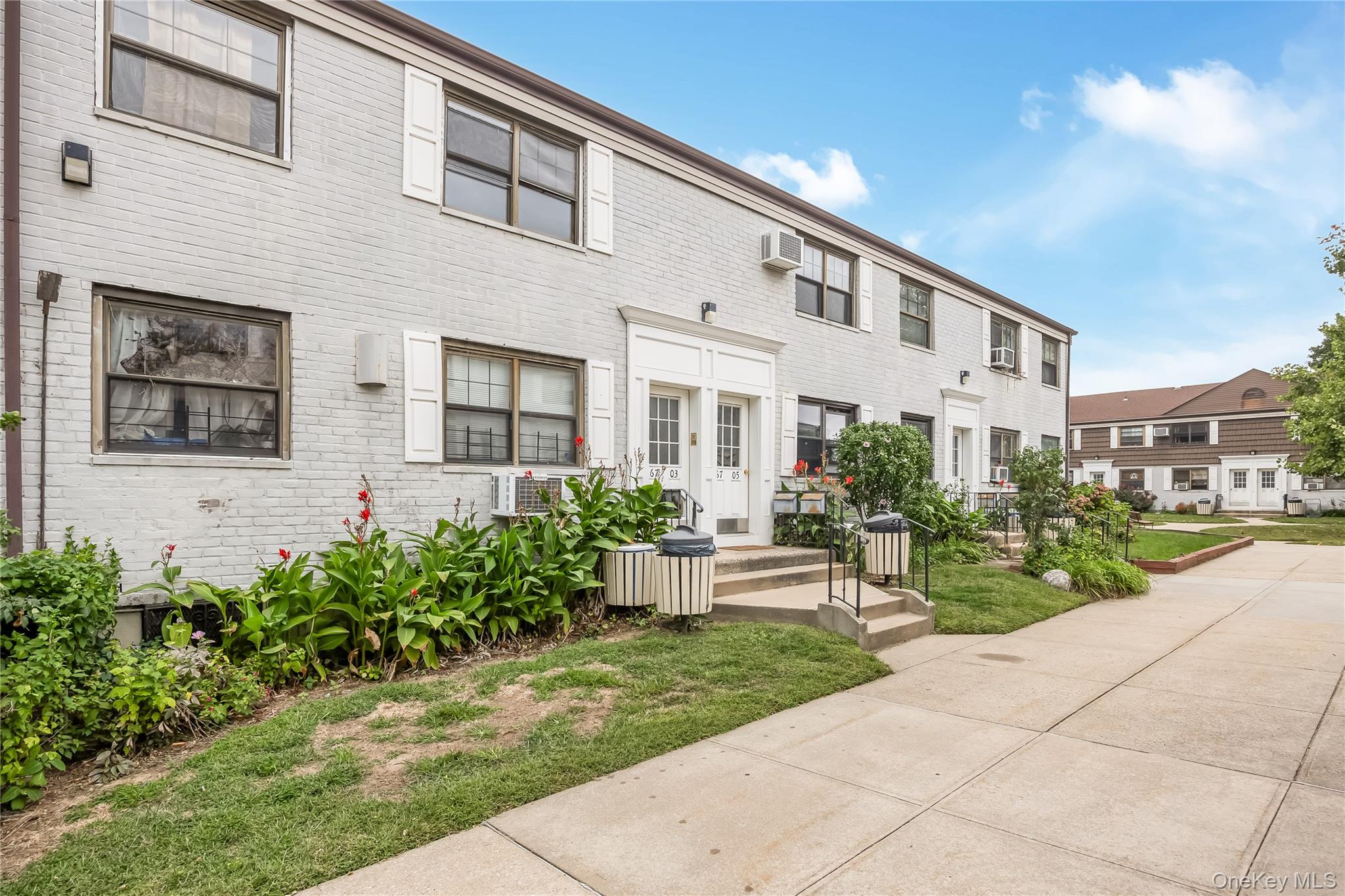 6703 136th Street, Unit B Queens, NY 11367 - Photo 13 of 14 a front view of a building with garden