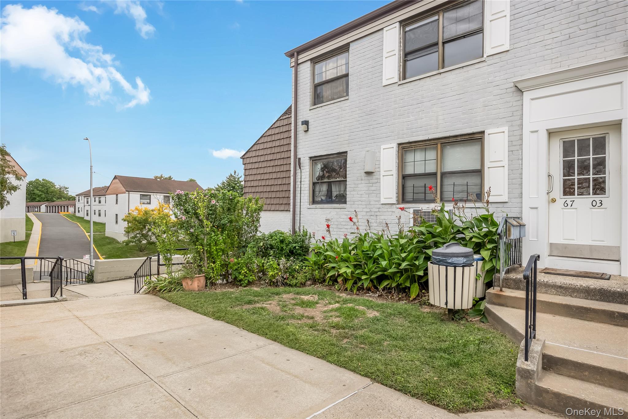 6703 136th Street, Unit B Queens, NY 11367 - Photo 2 of 14 a view of a house with backyard sitting area and garden