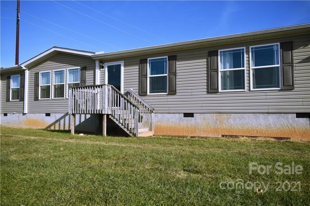 11 Fernwood Road Clyde, NC 28721 - Photo 1 of 26 a view of front of house with a yard