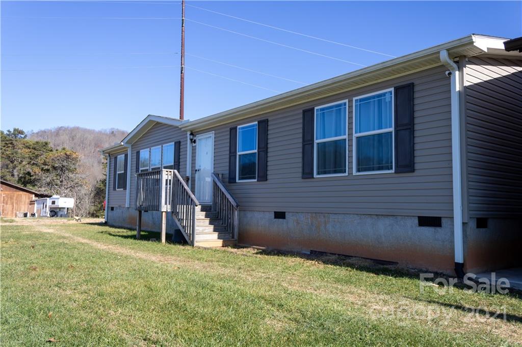 11 Fernwood Road Clyde, NC 28721 - Photo 2 of 26 a view of a house with a yard