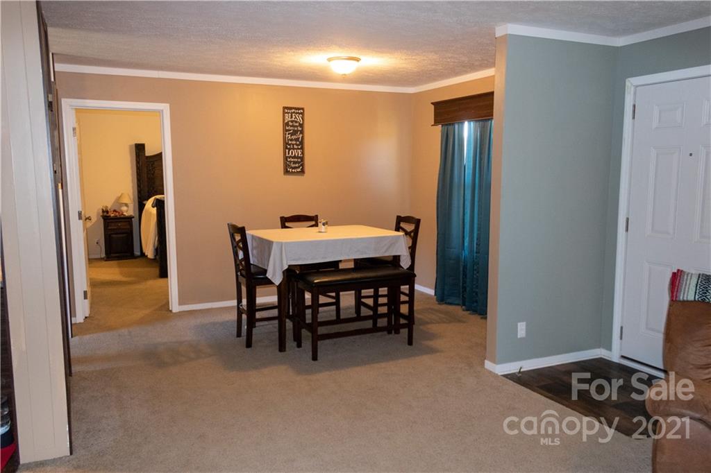 11 Fernwood Road Clyde, NC 28721 - Photo 11 of 26 a dining room with furniture and a flat screen tv