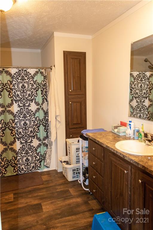 11 Fernwood Road Clyde, NC 28721 - Photo 13 of 26 a bathroom with a granite countertop sink toilet and shower