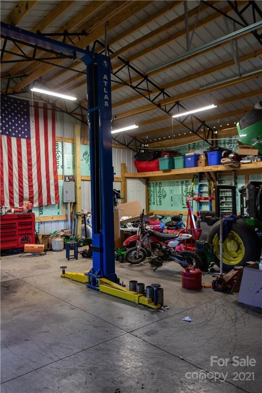 11 Fernwood Road Clyde, NC 28721 - Photo 24 of 26 a view of a garage with parked cars