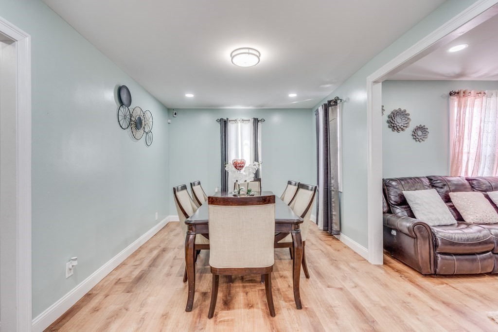 33 Ladd Street Springfield, MA 01109 - Photo 9 of 17 a view of a dining room with furniture window and wooden floor