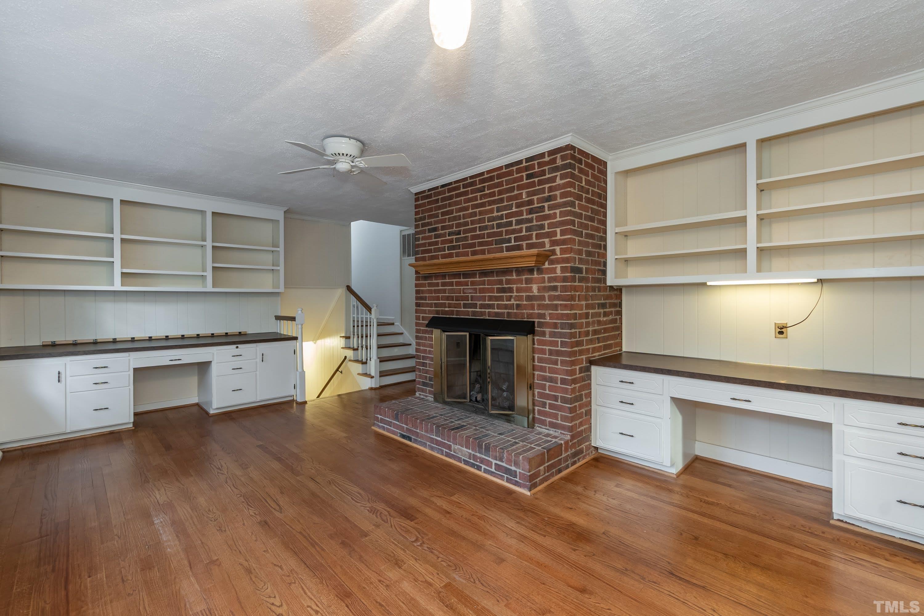 1104 Deboy Street Raleigh, NC 27606 - Photo 15 of 38 a living room with furniture and a fireplace