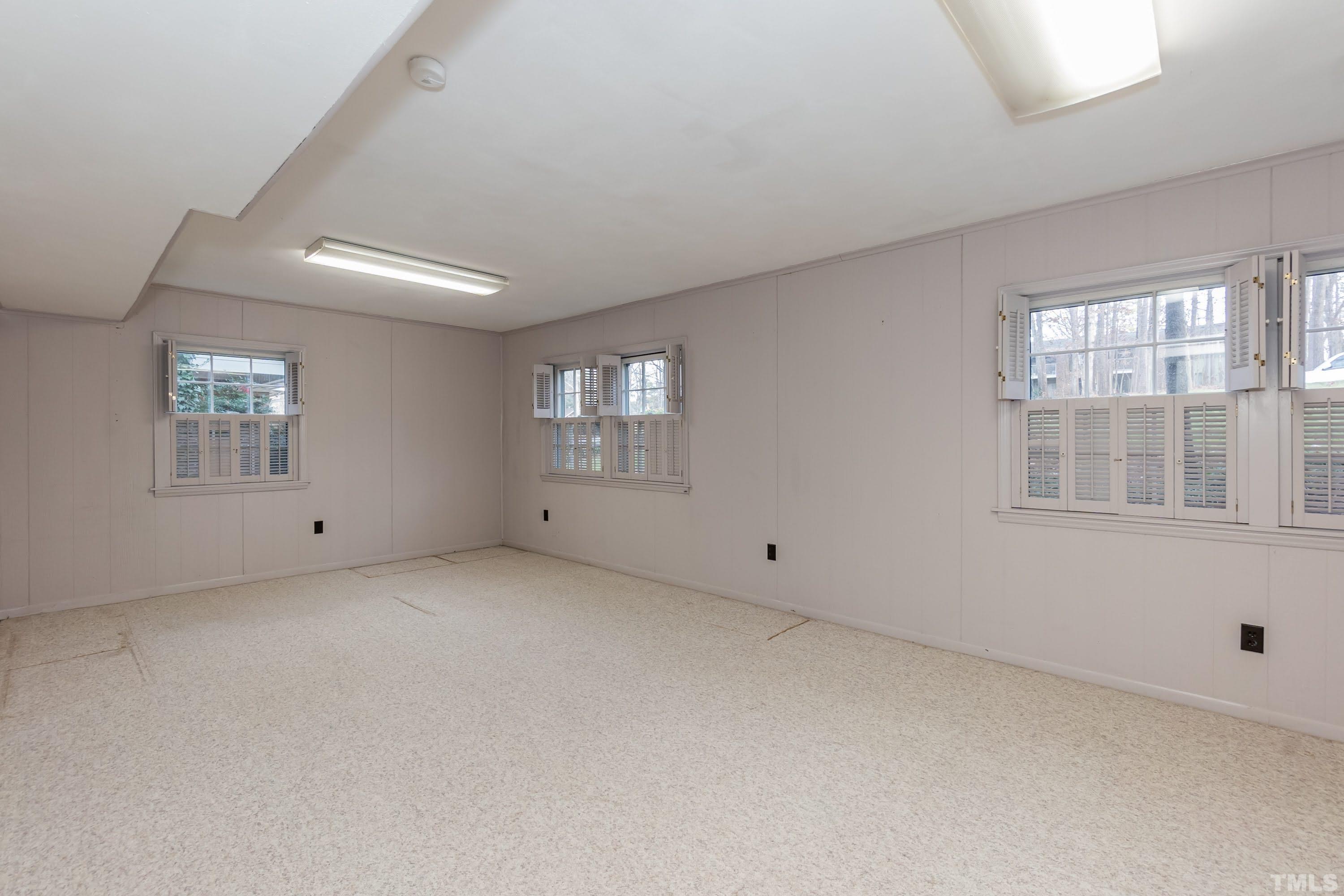 1104 Deboy Street Raleigh, NC 27606 - Photo 27 of 38 an empty room with windows